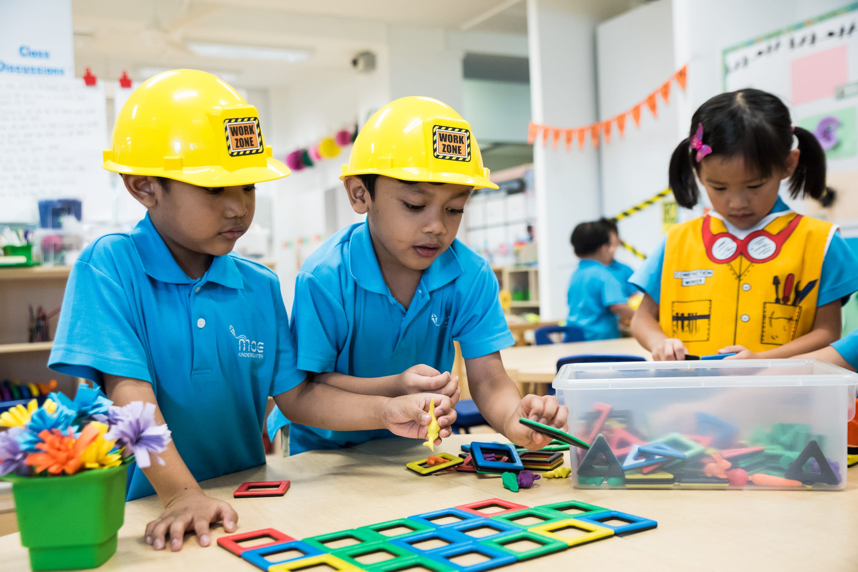 children playing with square blocks